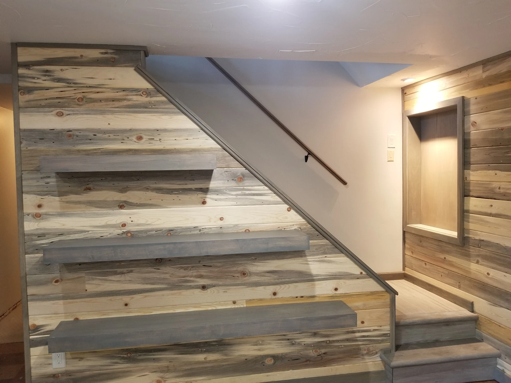 Custom wood accent wall and built-in display niche