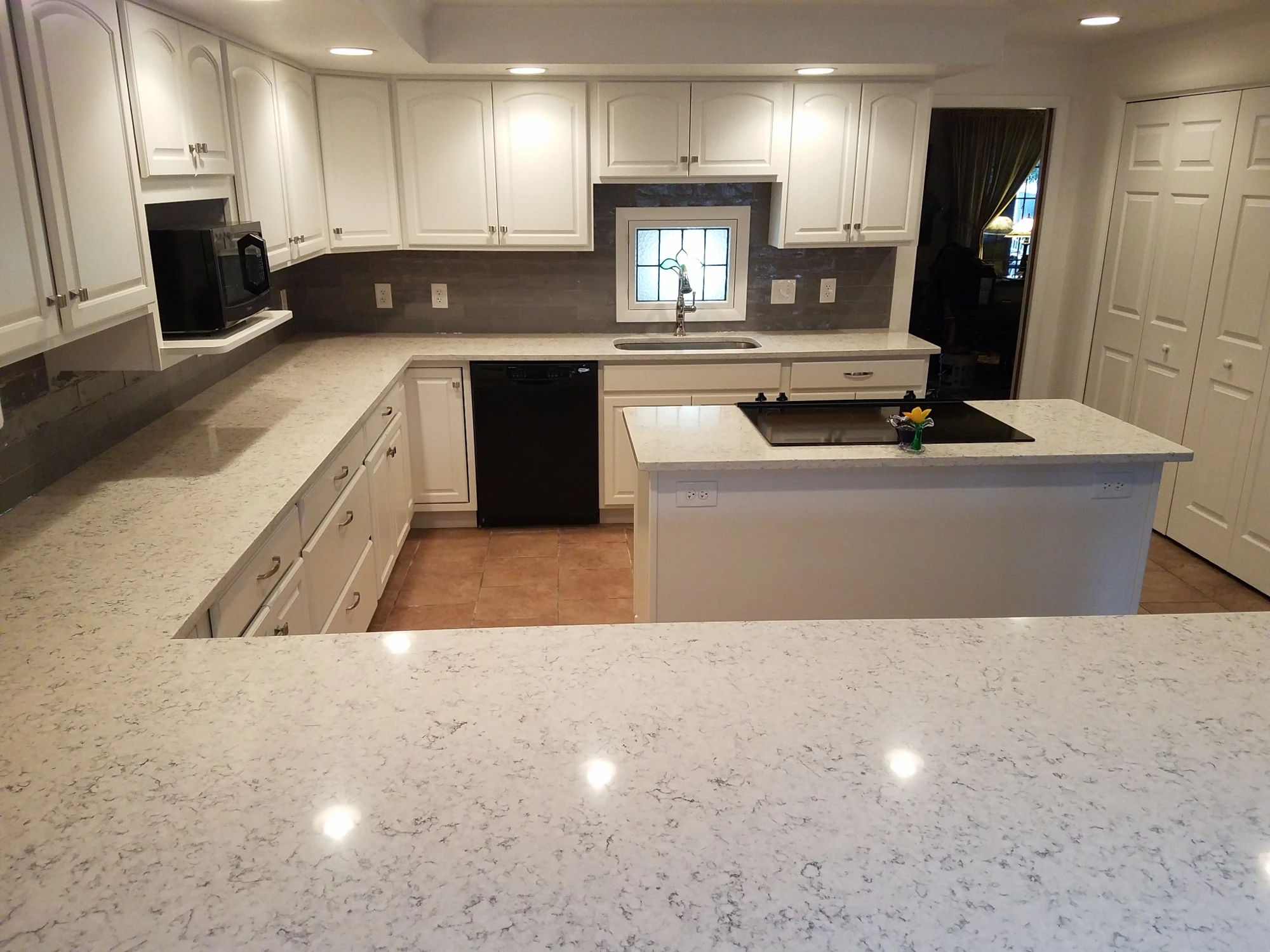 Wide view of remodeled white kitchen